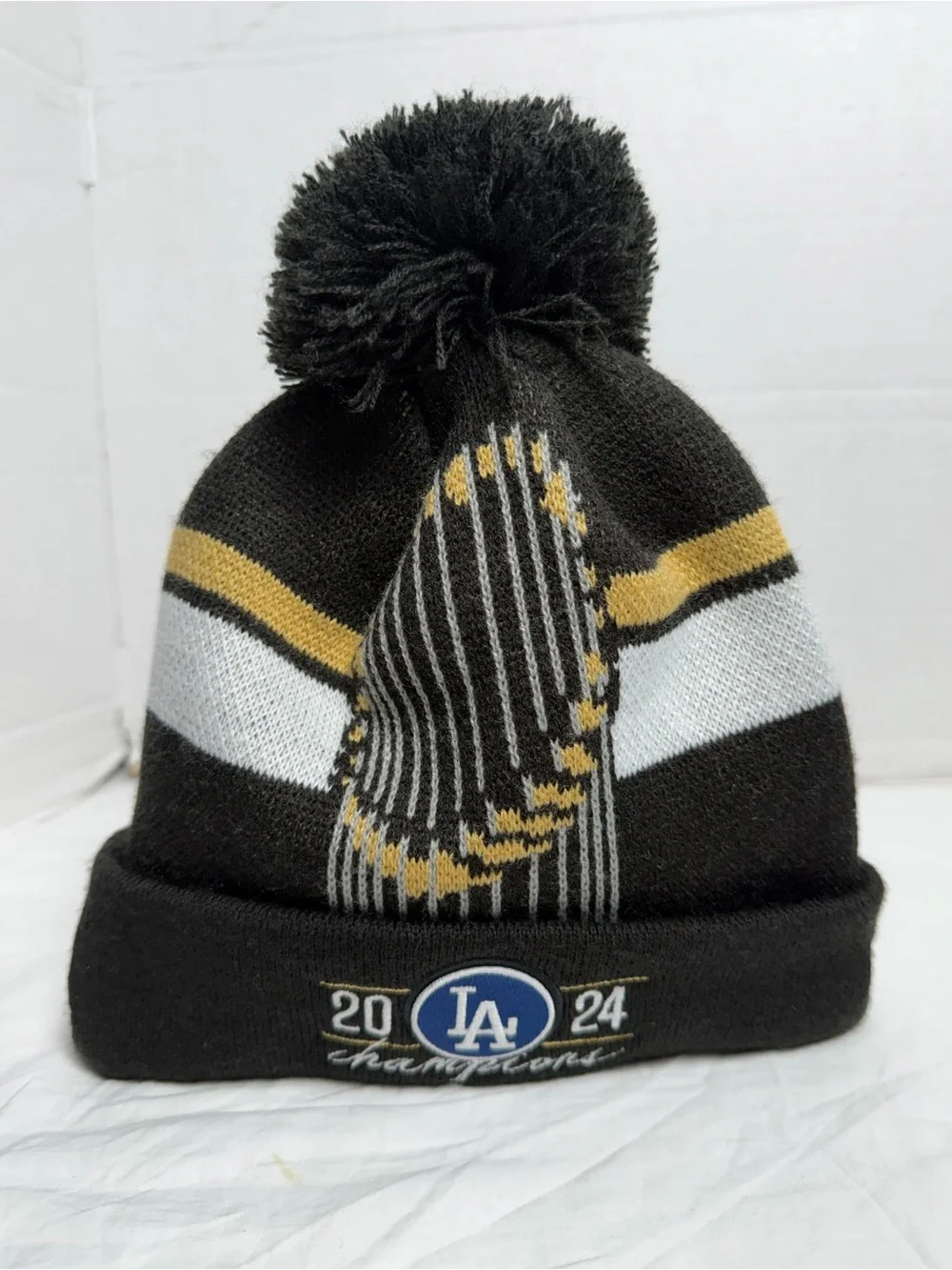 New Era Los Angeles Dodgers Black, White & Gold 2024 Champions Pom Beanie